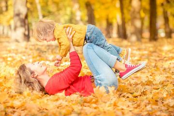 Sticker - Happy family having fun outdoor in autumn park