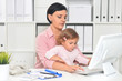© aletia2011 - Businesswoman with her child working in office
