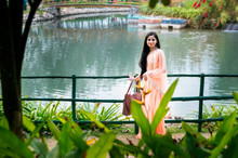Close Up Portrait Of Young Beautiful Indian Or South Asian Teenage Girl In Traditional Dress, Outdoor Image Near Waterfall
