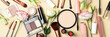 © Atlas - Different makeup cosmetics and flowers on beige background. Female accessories