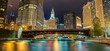Reflections of Chicago River Canal at Night with Surrounding Skyscrapers