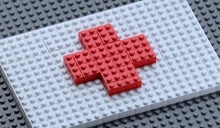 Flag Of The Red Cross Organization Made Of  Plastic Block Bricks