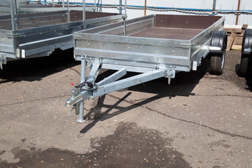 Car open trailer.A store that sells car trailers. Repair and maintenance of trailers for passenger cars.