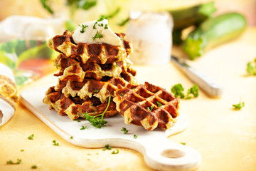 Sticker - Homemade low carb zucchini waffles on white wooden board on yellow background. Concept of keto diet food.