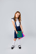 © Julie Boro - cute girl in school uniform holds school notebooks in hands
