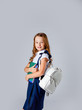© Julie Boro - cute girl in school uniform holds school notebooks in hands