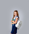 © Julie Boro - cute girl in school uniform holds school notebooks in hands