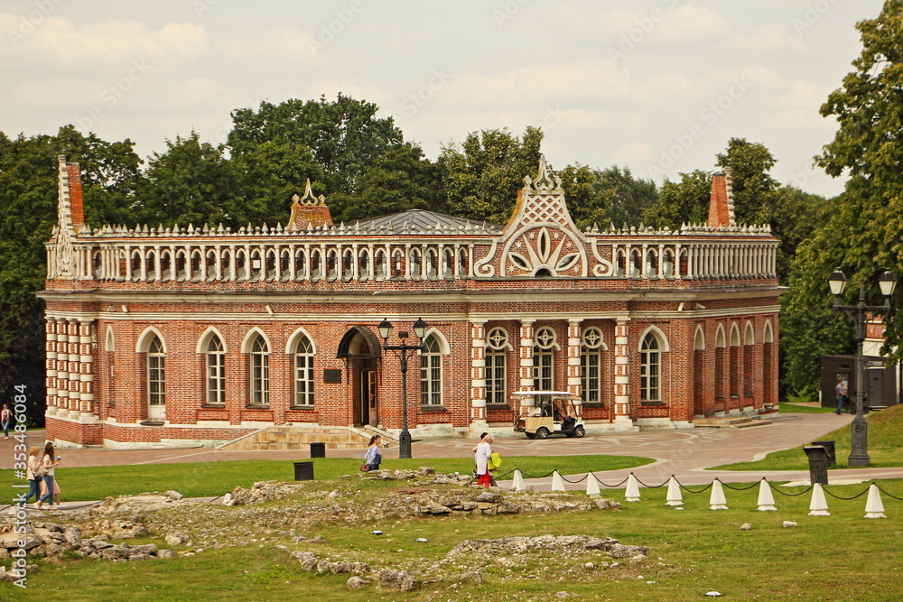 Moscow / Russia – 07 16 2019: 2nd Cavalier house and ancient historical ruins in Tsaritsyno Park Museum on summer day