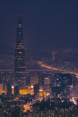 Canvas Print - Vertical shot of the magnificent Lotte Tower captured at night in Seoul, South Korea