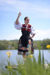 © muro - Young beautiful slovak woman in traditional costume. Slovak folklore.
