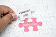 Missing puzzle with a word CONFLICT RESOLUTION. Business concept puzzle piece. Business and finance concept.