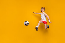 Full Length Body Size View Of Nice Funky Crazy Overjoyed Ecstatic Glad Excited Cheerful Cheery Motivated Guy Jumping Playing Soccer Isolated Over Bright Vivid Shine Vibrant Yellow Color Background