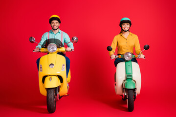 Canvas Print - Portrait of his he her she nice attractive funny cheerful cheery confident couple riding moped traveling having fun isolated over bright vivid shine vibrant red color background