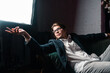 © teksomolika - close-up portrait of an attractive young man relaxing on the couch
