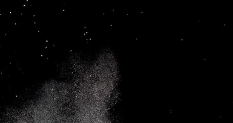 Wall Mural - snow falling against a black background.