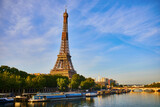 Fototapeta Paryż - Scenic view of Eiffel tower over the river Seine