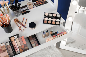 Wall Mural - Table with makeup cosmetics in modern dressing room