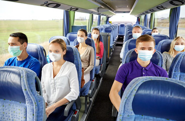 Sticker - transport, tourism, road trip and people concept - group of passengers or tourists wearing face protective medical masks for protection from virus disease in travel bus