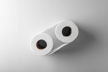 Two roll of toilet paper on white color paper background. Hygiene, bathroom, clean and sanitary concept art photo.