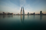 Fototapeta  - The Bahrain World Trade Center during dusk, a twin tower complex is the first skyscraper in the world to have wind turbines, photographed on February 05, 2018, Manama, Bahrain