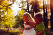 © justesfir - Little girl and boy play outdoors in summer