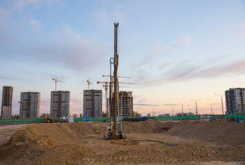 Poster - Vertical tamrock pile foundation drilling machine. Drill rig at construction site. Ground Improvement techniques, vibroflotation probe. Vibro compaction method. Piling Contractors