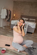 © Impact Photography - Pregnant woman listening to the music