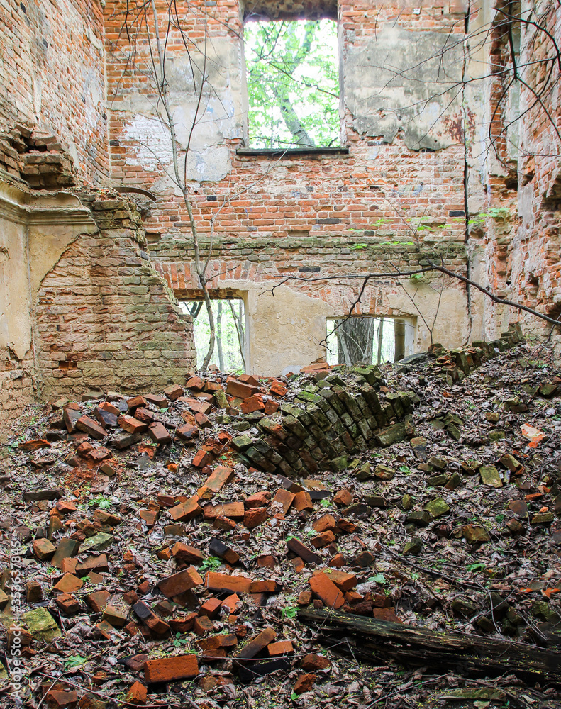 Brick walls of an ancient ruined house. The old facade of a ruined ...