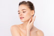 © kitthanes - Beautiful Young Woman touching her clean face with fresh Healthy Skin, isolated on white background, Beauty Cosmetics and Facial treatment Concept.