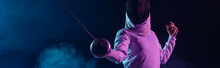 Panoramic Crop Of Swordswoman Fencing On Black Background With Smoke And Lighting