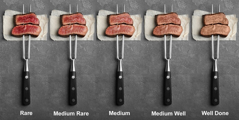 delicious sliced beef tenderloins with different degrees of doneness on grey background, top view. b