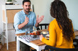 © Tijana - Couple talking and having breakfast stock photo
