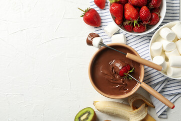 Wall Mural - Composition with strawberry and marshmallow in chocolate, top view. Chocolate fondue