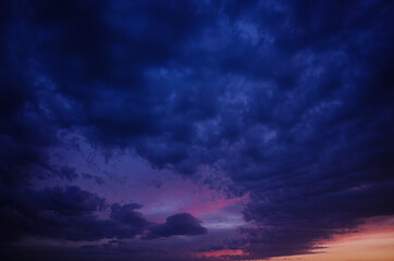 Colorful sunset. Blue, pink and red colors. Dark look.