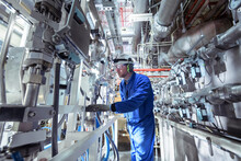 Engineer Inspecting Equipment In A Nuclear Power Station.