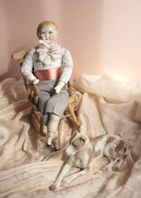Little Porcelain Statue Of A Boy Sitting On A Chair With A Dog, Vintage Doll, Antiques