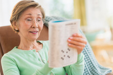 Senior Woman Doing Crossword Puzzle