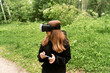 © Maxim - girl with glasses controls virtual reality using a phone