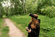 © Maxim - girl with glasses controls virtual reality using a phone