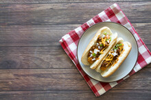 Chili Cheese Hot Dog On A Wooden Table
