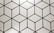 geometrical pattern with black line cubes on a white wall
