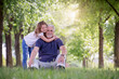 © nellas - Grandfather and his granddaughter  playing  outdoors