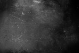 Fototapeta Desenie - Dark grunge scratched background, distressed chalkboard texture, old film effect