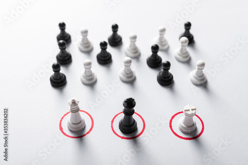 Cuadros en Lienzo Chess pieces on a white background with red special round places