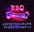 © moloko88 - Red and Pink Neon BBQ Pig sign on a brick background . BBQ of Neon-Style.