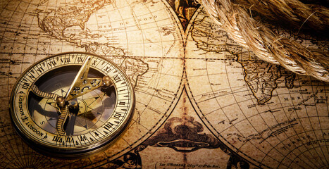 magnetic old compass on world vintage map 18 century.travel, geography, navigation, tourism and expl