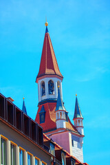 Wall Mural - rooftop of Roman Catholic church with bell tower