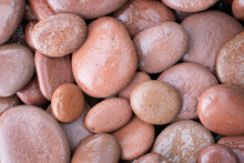 Abstract Background With Red Brown Wet Round Reeble Stones