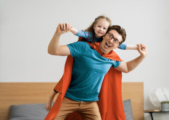 Wall Mural - Girl and daddy in Superhero costume