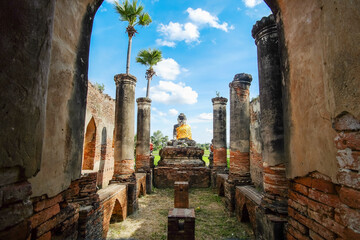 Wall Mural - Buddha statue in old temple in Inwa (Ava) near Mandalay in Myanmar (Burma). Southeast Asia travel concepts